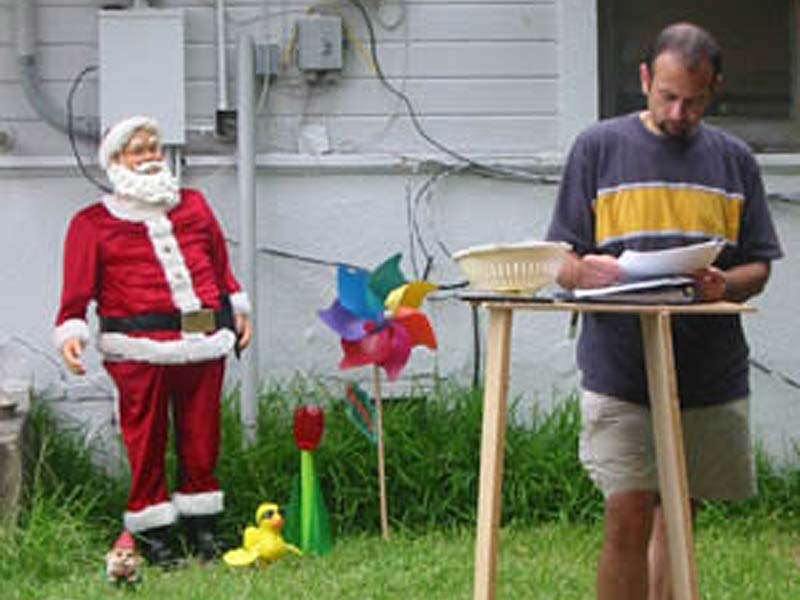 Filmmaker Chris Hansen takes notes between filming scenes