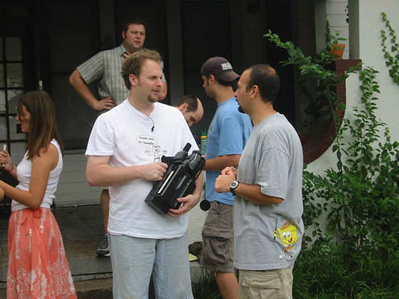 Chris Hansen and Joseph Frost confer on the set of The Proper Care & Feeding of an American Messiah